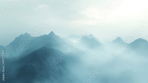 Misty mountain range with a light blue sky.