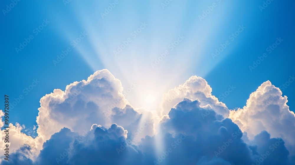 Fototapeta premium Radiant sunlight shining through fluffy clouds in a clear blue sky, showcasing the beauty of nature and tranquility