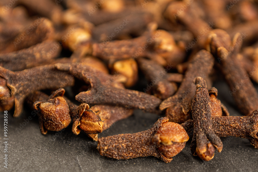 A close-up of aromatic cloves, highlighting the texture and rich color A close-up of aromatic cloves, highlighting the texture and rich color
