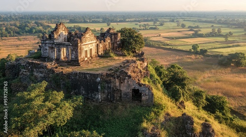 Top view of Phnom Chisor, with its ancient ruins perched on a hilltop offering panoramic views of the fields below. photo