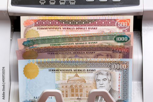 Turkmenistani manat in the counting machine photo