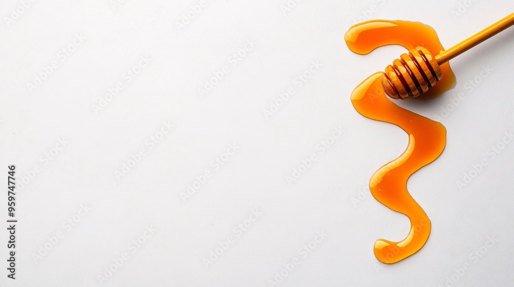 Fototapeta premium honey dipper with flowing honey on white background
