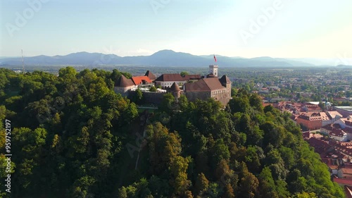 Stunning drone footage of Ljubljana, Slovenia, showcasing the charming old town, the medieval castle, and the vibrant city center with its picturesque streets and unique architecture. photo