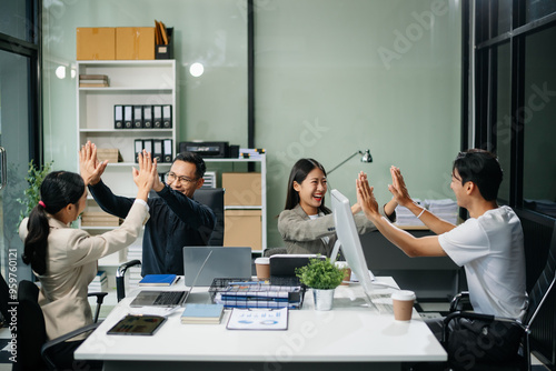 Group of Asian business meeting in planning design in creative business discussing work