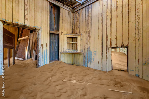 An abandoned and desolate room buried in the sand in the ghoast towm Komanskoppe - once a diamond mining, near Luderitz, Namibia.