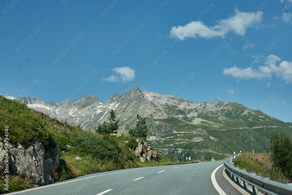 Fototapeta premium Road tripping through the Swiss Alps on Grimselpass, with its panoramic views