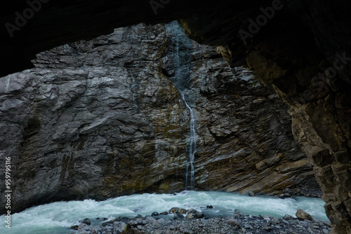 Hiking to the Gletscherschlucht glacier in Grindelwald, with imposing canyons, waterfalls and panoramic views of the valley. Swiss Alps