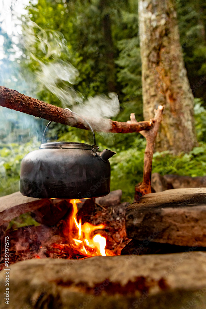 Coffee pot on a campfire during a hike in the mountains. Coffee pot on a campfire during a hike in the mountains.