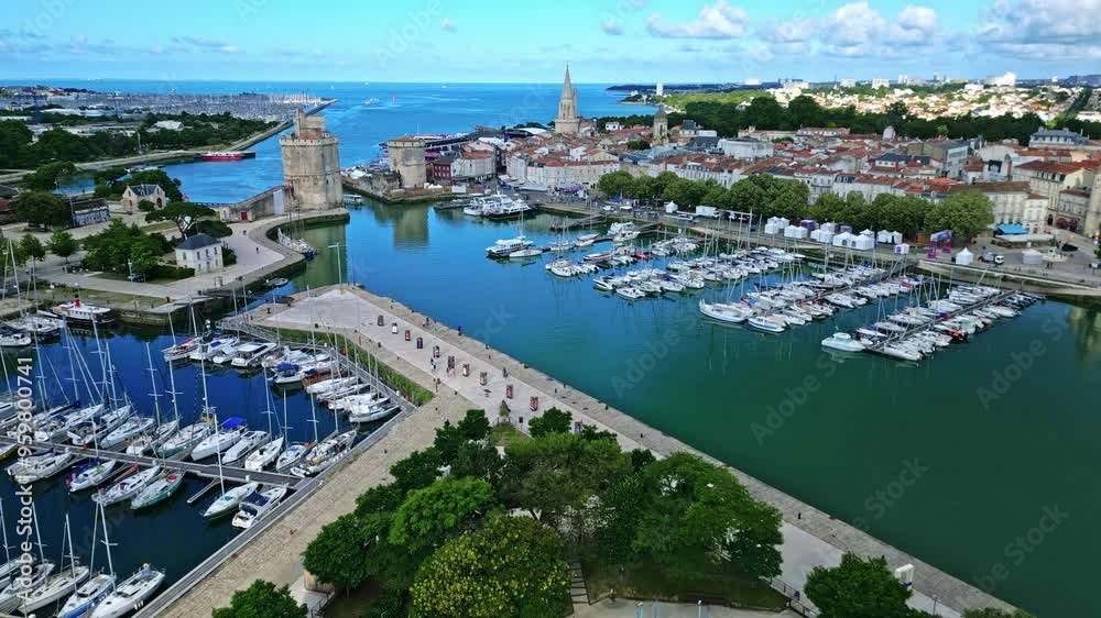 The old port with Saint Nicolas and Lantern Tower in background, La Rochelle, France. Aerial drone view