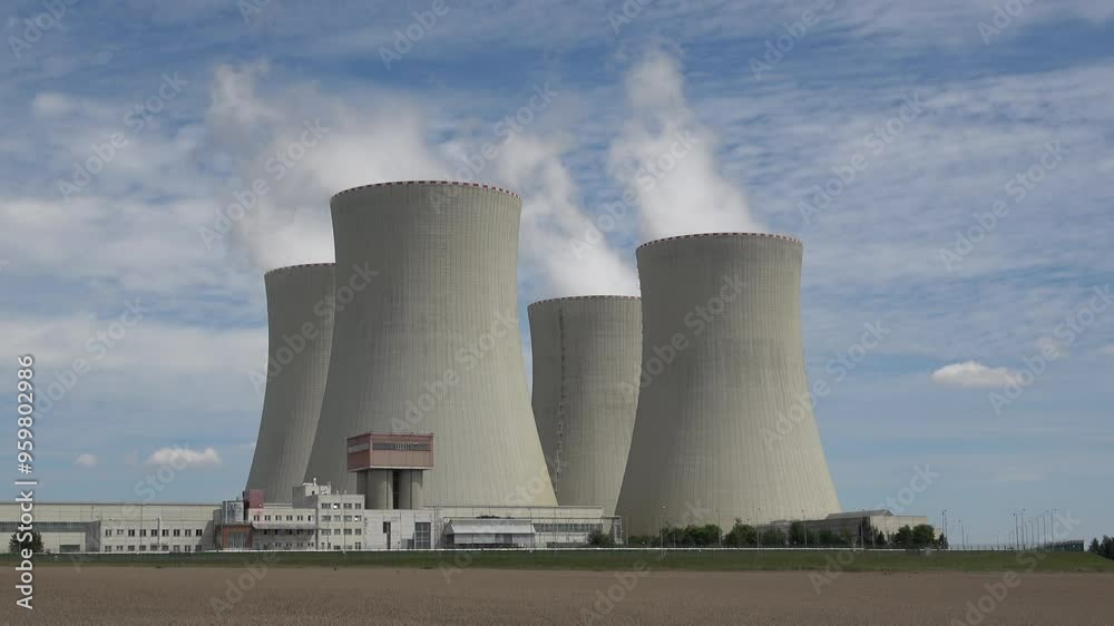 Nuclear power plant Temelin in hot summer weather. South bohemia in Czech republic, European union. Large nuclear power station proucing electricity. Nuclear power plant Temelin in hot summer weather. South bohemia in Czech republic, European union. Large nuclear power station proucing electricity.