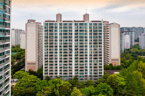 Suji-gu, Yongin-si, Gyeonggi-do, South Korea - April 22, 2021: High angle view of high-rise apartments with trees in spring at Sanghyeon Village photo