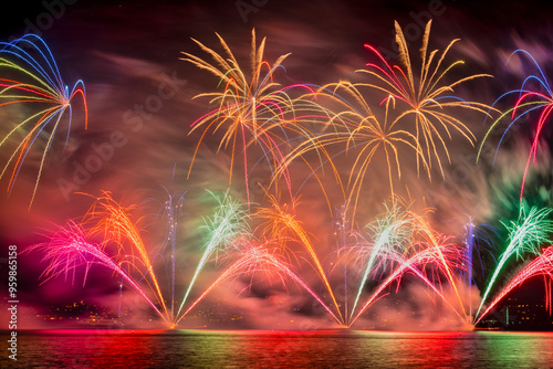 View of colorful fireworks illuminating the night sky over Lake Zurich, Zurich, Switzerland.