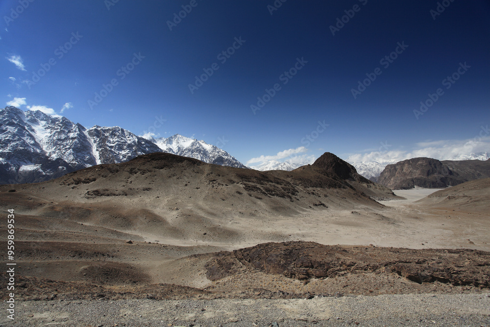 View of majestic snow-capped mountains under a clear sky, Skardu, Pakistan. View of majestic snow-capped mountains under a clear sky, Skardu, Pakistan.