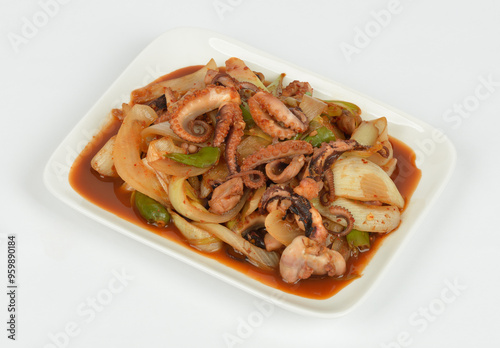 Close up of Korean food stir-fried webfoot octopus with hot pepper paste on white plate with white background, South Korea 