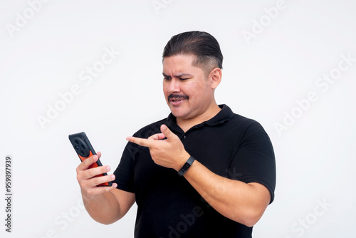 A cynical middle aged man criticizing cringe inducing posts and comments while browsing his social media. Isolated on a white background. photo