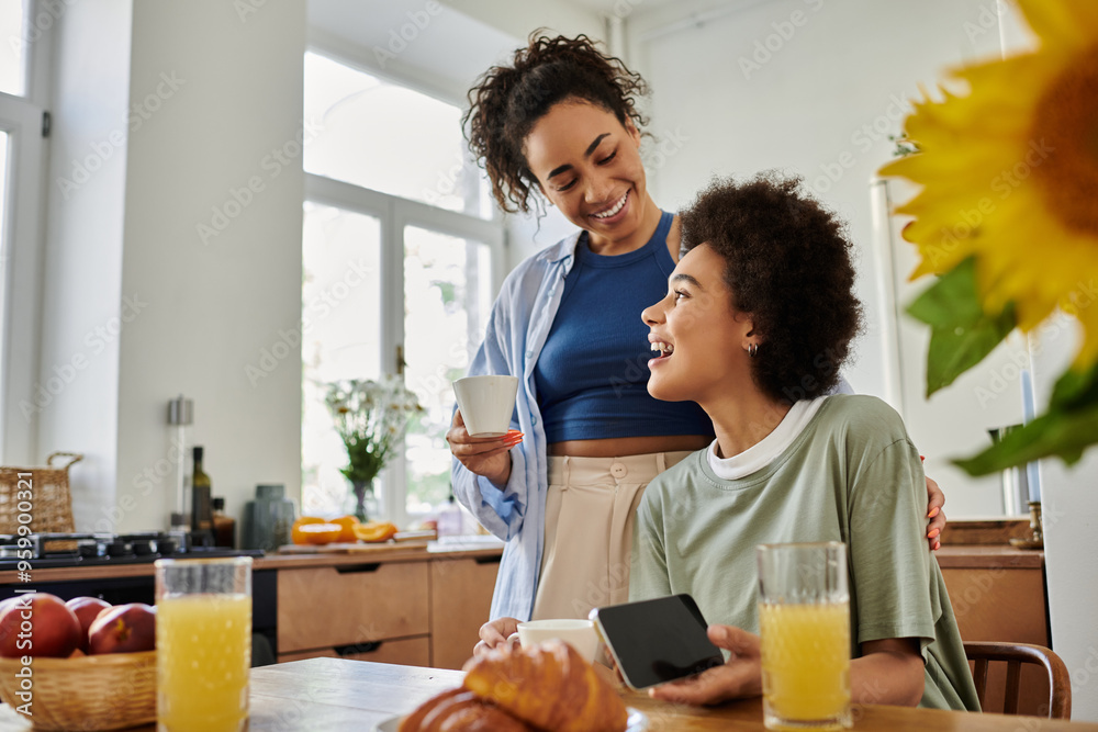 A couple enjoys a delightful morning together over breakfast and warm beverages. A couple enjoys a delightful morning together over breakfast and warm beverages.