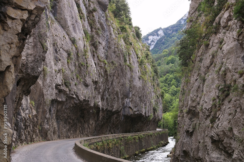 Fototapeta premium Road alongside Aude river bordered by Gorges de Saint Georges, a gorge located near the town of Axat in Aude department, southern France 