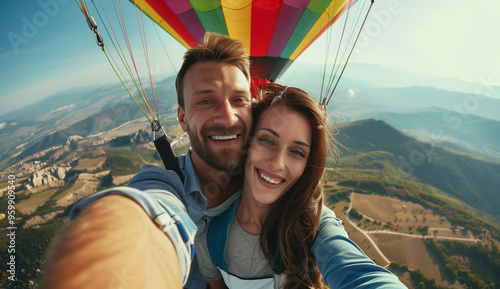 European couple in a hot air balloon in nature. Hot air balloon ride over mountains. Happy couple on a vacation holiday honeymoon date engagement excursion trip. Italian Spanish German Mediterranean  photo