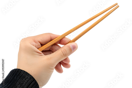 A hand holding wooden chopsticks, isolated on white or transparent background, PNG photo