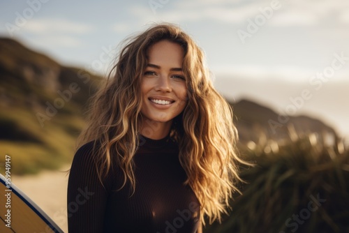 Portrait of a young Caucasian female surfer on the beach