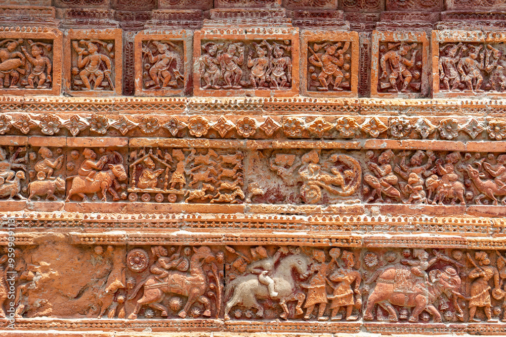 Closeup view of carved terracotta on ancient Govinda temple in Puthia religious complex, Rajshahi, Bangladesh.