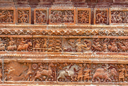 Obraz na płótnie Closeup view of carved terracotta on ancient Govinda temple in Puthia religious complex, Rajshahi, Bangladesh. w salonie