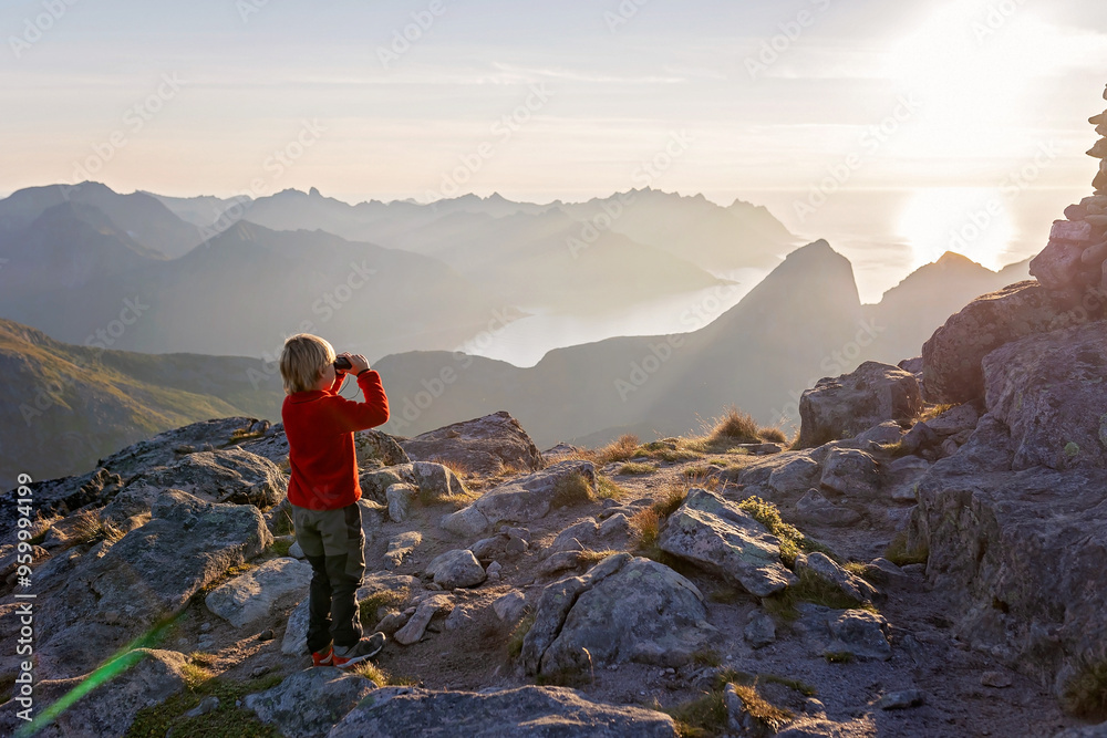 Fototapeta premium Children and adults, family with dog, hiking Grytetippen trail in Senja, Lofoten on a sunny hot summer day