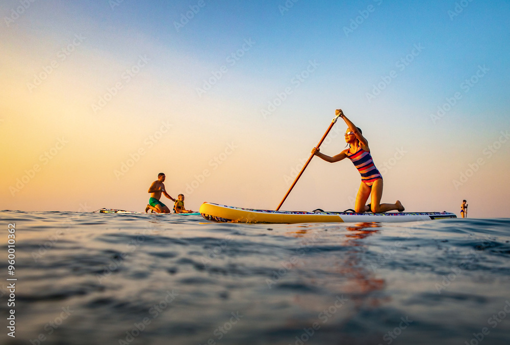 sup surfing in the sea