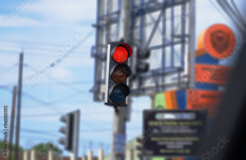 Red Traffic light installed at intersection in downtown Barru, Sulawesi Indonesia to prevent accident and vehicle crash.