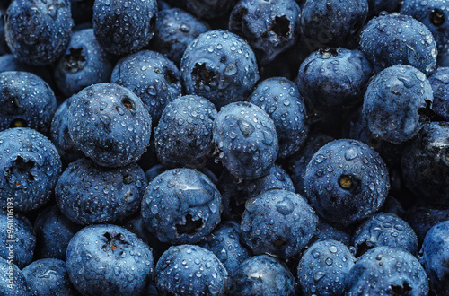 Tableau sur toile Zoomed image of ripe blueberry filling frame with bright color
