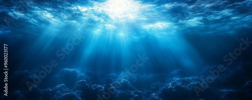 A gradient background featuring a central bright light radiating into deep blue tones