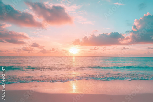 Serene sunset over a calm ocean with pink and blue sky and soft waves on the beach.