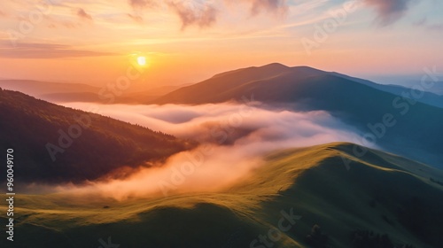 Rolling green hills bathed in sunlight with low clouds creating a foggy effect, giving a mystical and serene atmosphere. Perfect for a tranquil moment in nature