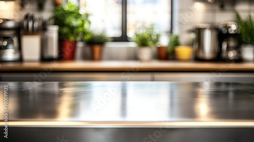 Bright and modern kitchen with a shiny countertop and vibrant plants creating a fresh and inviting atmosphere.