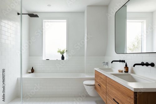 A minimalist bathroom with Scandinavian design, featuring white tiles, a wooden vanity, and sleek fixtures