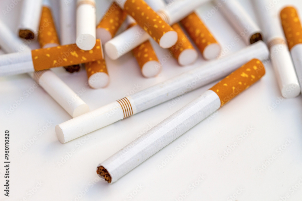 Close up stack of cigarettes on white background. cigarettes isolated on white Close up stack of cigarettes on white background. cigarettes isolated on white