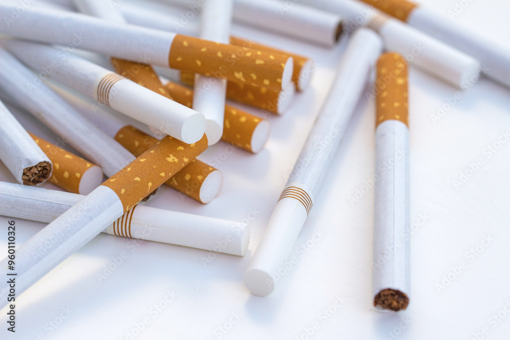 Close up stack of cigarettes on white background. cigarettes isolated on white Close up stack of cigarettes on white background. cigarettes isolated on white
