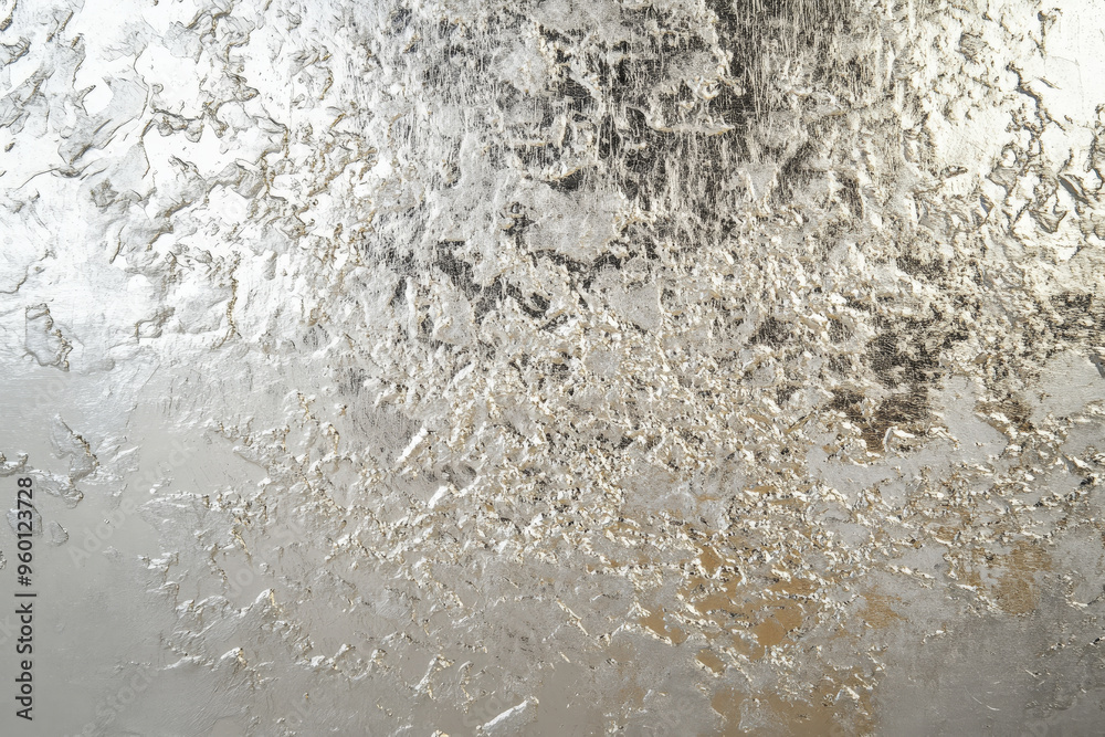 Obraz premium A silver textured surface with a fine, stippled pattern, resembling the texture of a finely painted canvas, but in cool, metallic tones.