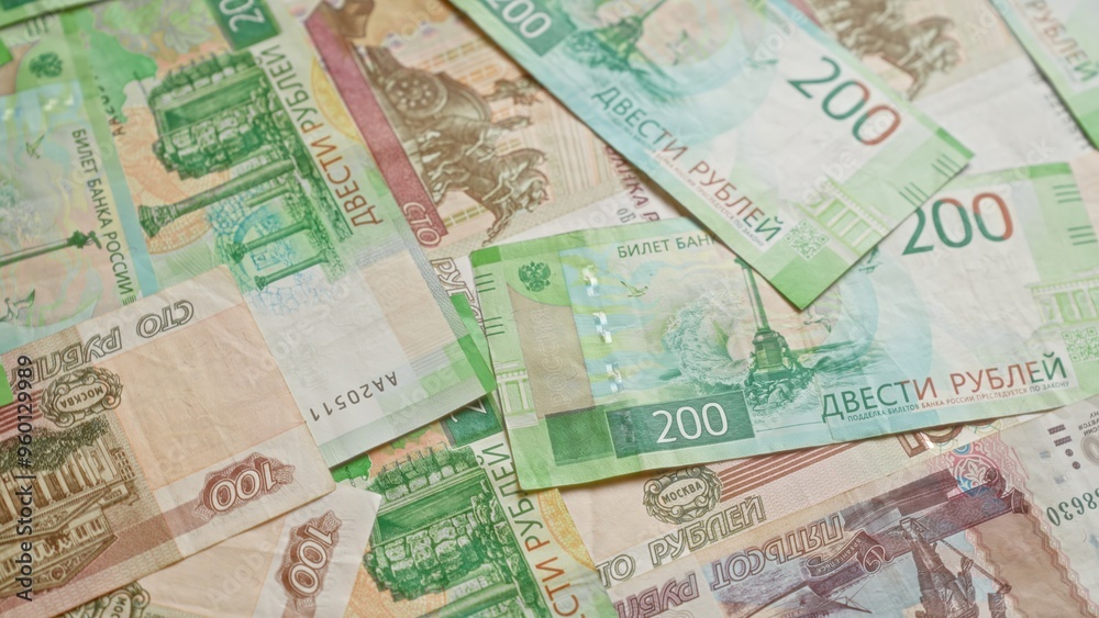 Russian ruble banknotes displayed closely together showcasing various denominations indicating a focus on financial and currency matters. Russian ruble banknotes displayed closely together showcasing various denominations indicating a focus on financial and currency matters.