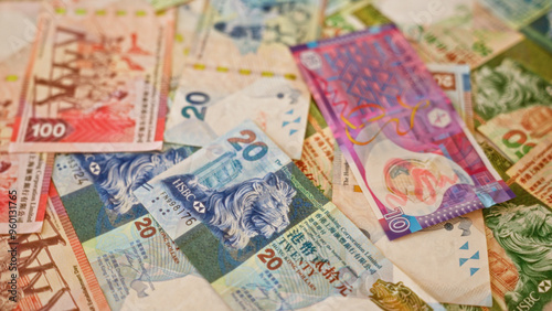 Hong kong dollar close-up, showcasing colorful currency notes spread out in a dynamic arrangement, highlighting the vibrant financial setting of hong kong. photo