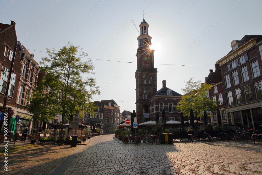 Groenmarkt, a pedestrian street located in the old picturesque town of Zutphen, Gelderland, Netherlands, with the tower Wijndragerstoren (or Wijnhuistoren)