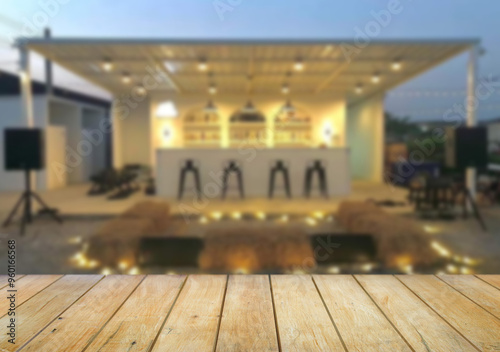 Wooden table top on blur night restaurant or cafe background.For montage product display or design key visual layout.View of copy space.