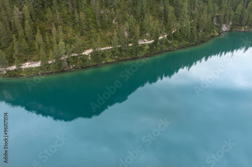 aerial view of the dirt path that runs along the lake of braies in trentino alto adige italy
