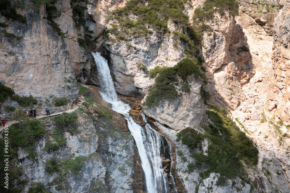 aerial view of the waterfalls produced in the val di fanes veneto with people on the via ferrata aerial view of the waterfalls produced in the val di fanes veneto with people on the via ferrata