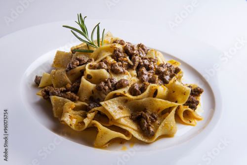 Plate with pappardelle with wild boar ragout sauce and rosemary