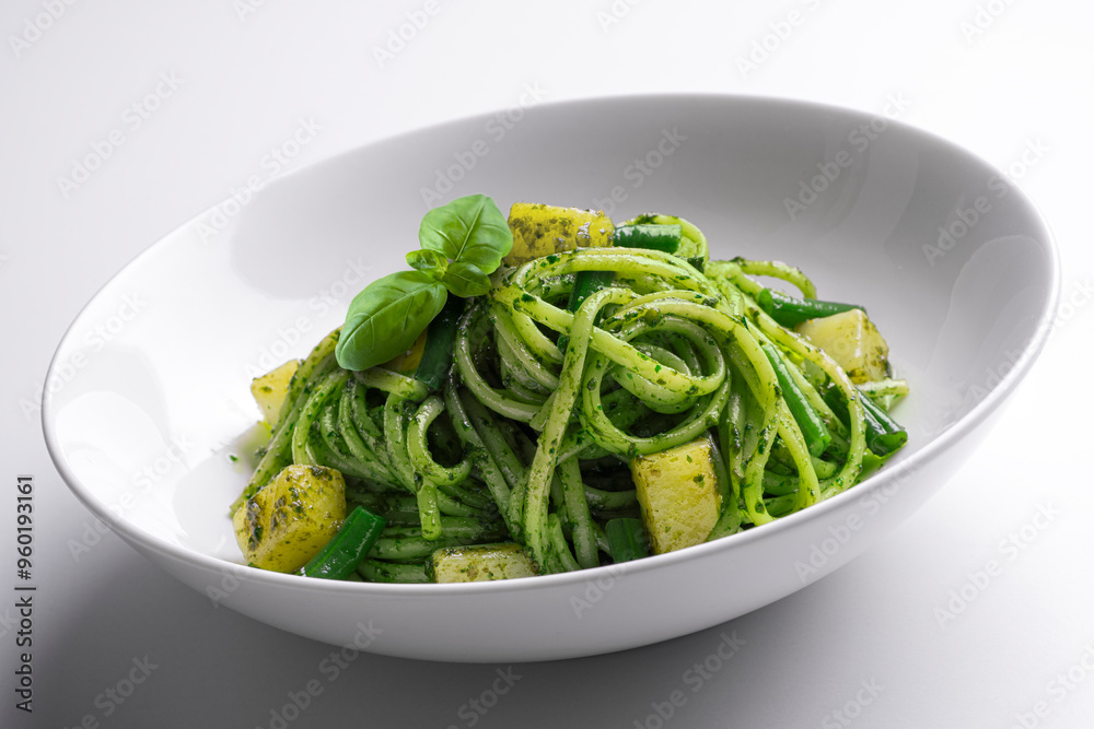 Bowl with linguine with Genoese pesto sauce with potatoes and green beans Bowl with linguine with Genoese pesto sauce with potatoes and green beans