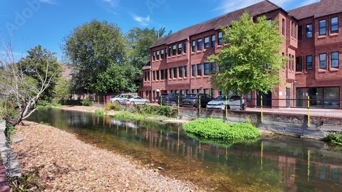 Salisbury Wiltshire England UK. 27.08.2024. Video.  Brick built new offices overlooking Salisbury River Park a new development in the city centre. photo