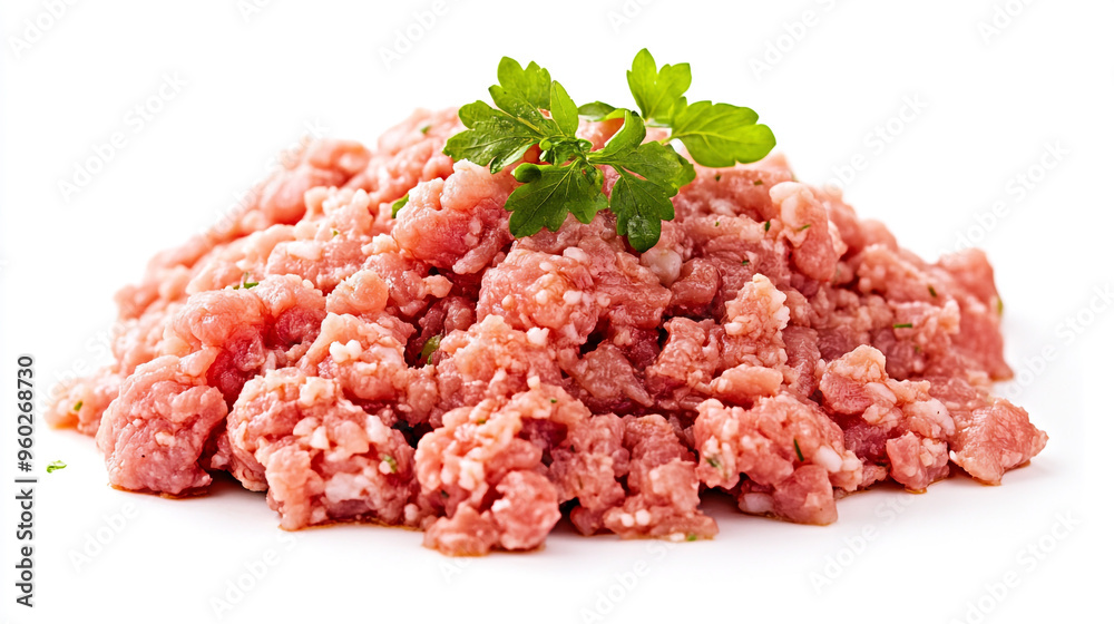 Fresh ground meat on a white surface with garnishing leaves, ready for cooking and meal preparation Fresh ground meat on a white surface with garnishing leaves, ready for cooking and meal preparation