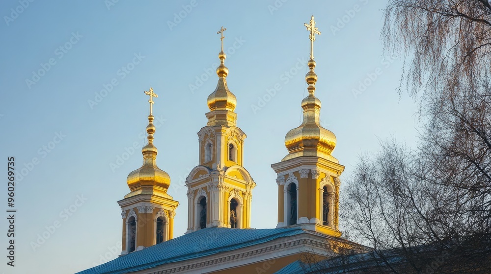 The golden spires of Peter and Paul Fortress in St. Petersburg under a clear sky. The golden spires of Peter and Paul Fortress in St. Petersburg under a clear sky.