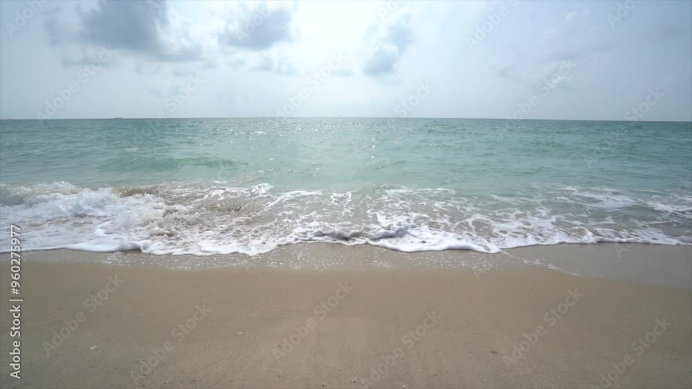 Slow motion of sea waves on beautiful sandy beach of Koh Lanta, Krabi province, southern Thailand, Asia. Slow motion of sea waves on beautiful sandy beach of Koh Lanta, Krabi province, southern Thailand, Asia.